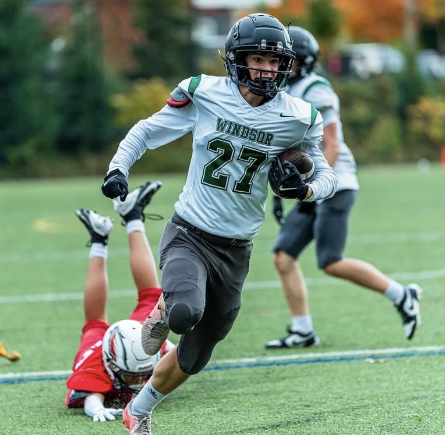 Windsor football running back breaking a tackle
