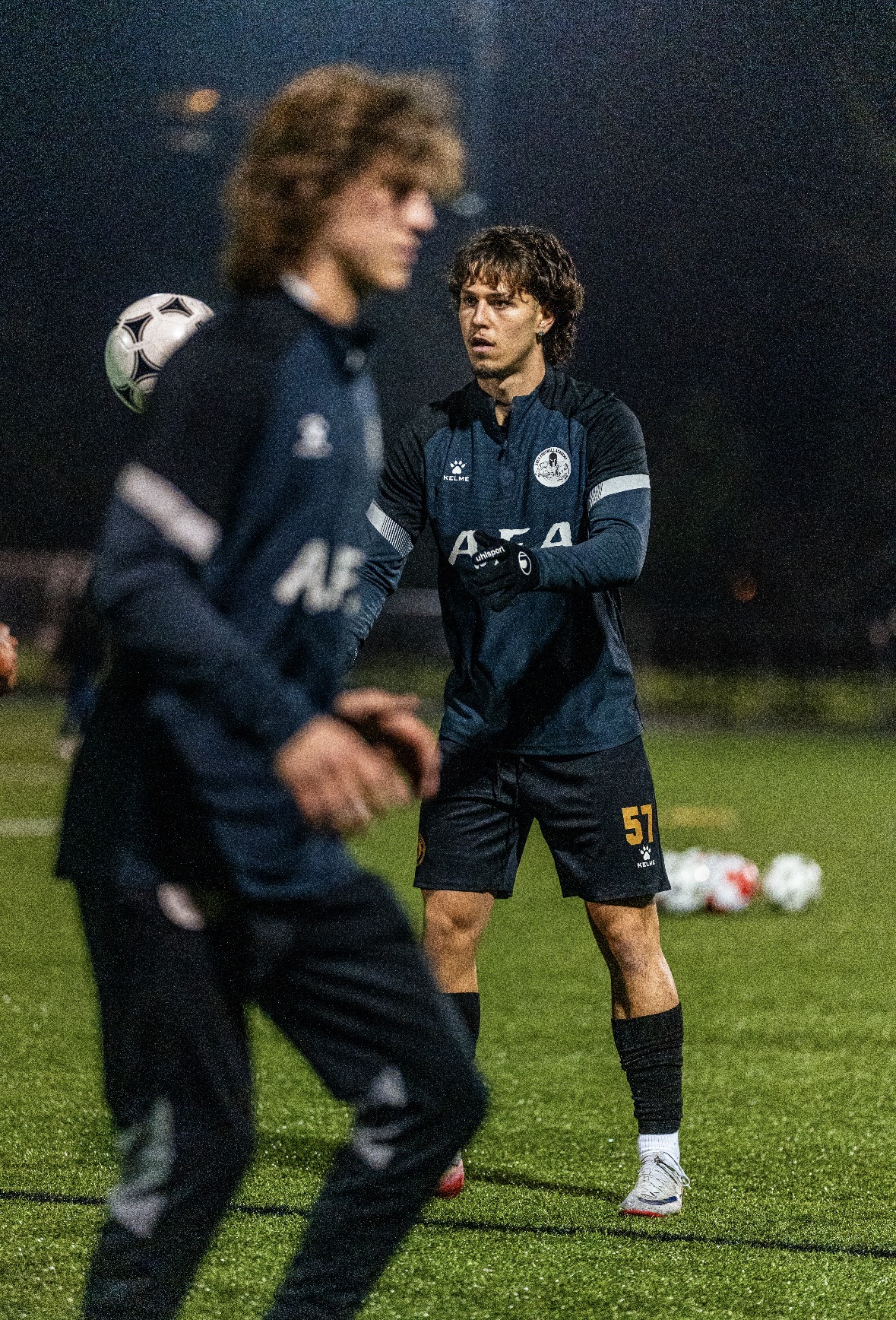 Goalkeeper warm-up under the lights